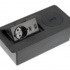 a black rectangular device with a power outlet